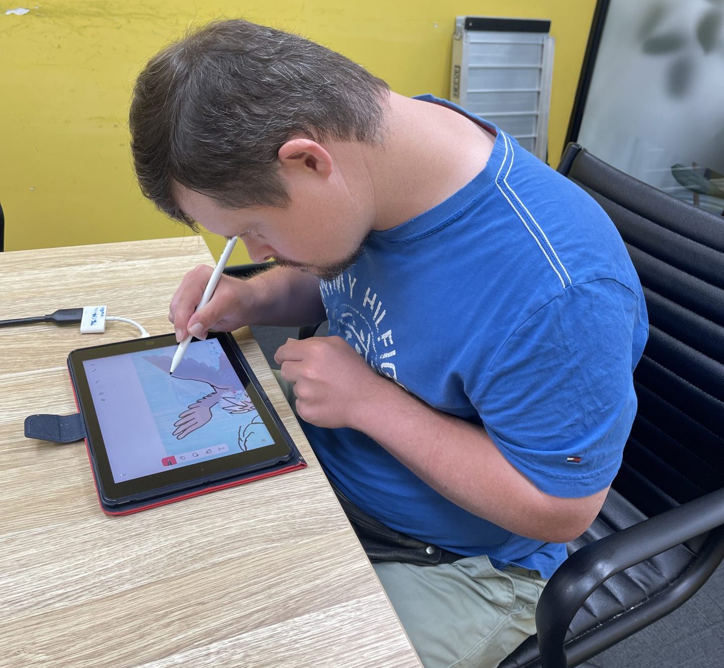 Scott using his iPad in the THC Tech Guru program